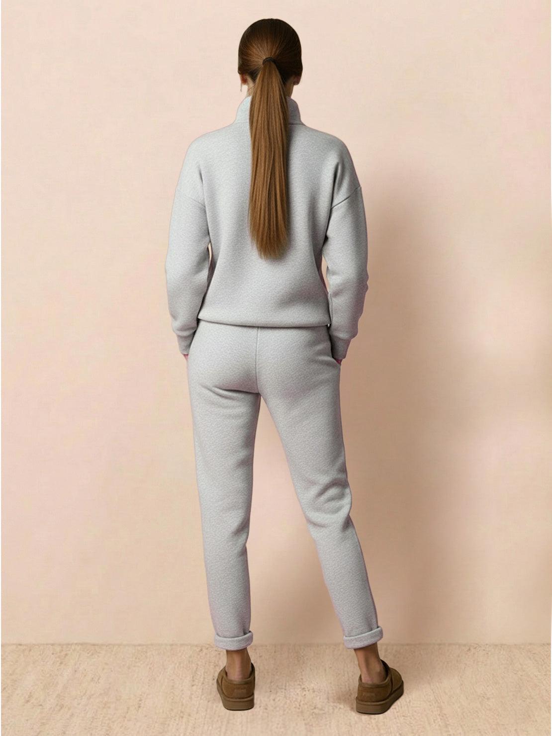 Woman wearing Warm & Easy Two-Piece Set in light gray, back view, relaxed fit sweatshirt and pants.