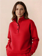Woman wearing a red Warm & Easy Two-Piece Set pullover sweatshirt with button collar, relaxed fit and soft fabric
