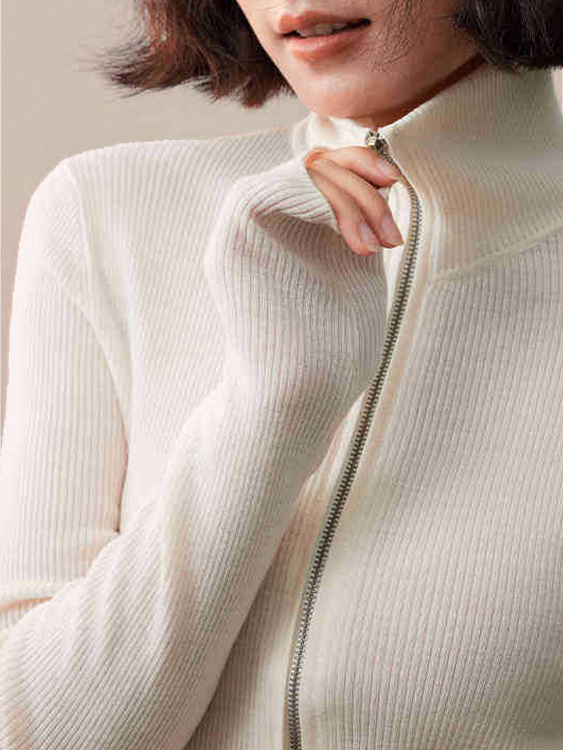 Black zip-up knit cardigan jacket with vertical ribbing and high neckline displayed on white background