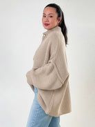 Oversized button-front knit cardigan with balloon sleeves and gold-tone buttons
