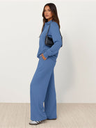 Wrinkle-free polo set with quarter-button top and high-waisted pants in breathable fabric
