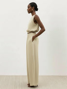 Lightweight linen-blend set with sleeveless top and wide-leg pants featuring elastic waistband and side slits for breathability