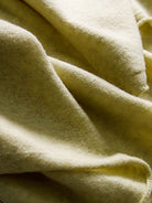 Long Australian Merino Wool cardigan with open front, ribbed cuffs, and patch pockets for versatile layering