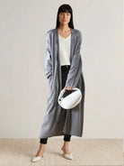 100% Australian Merino Wool long open-front cardigan with knee-length fit and front patch pockets