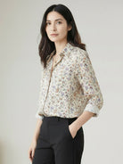 Floral button-down shirt with long roll-up sleeves and relaxed fit