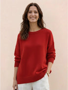 Oversized crew neck knit sweater with drop-shoulder sleeves and ribbed cuffs in neutral color