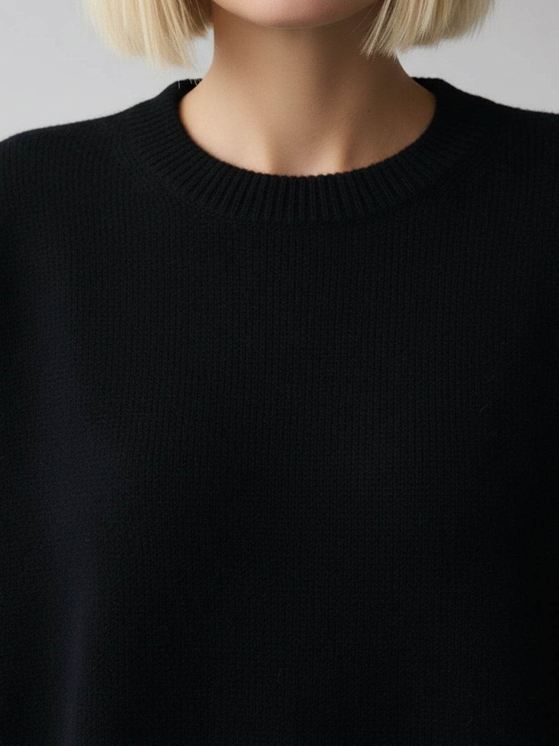 Oversized crew neck knit sweater with drop-shoulder sleeves and ribbed cuffs in neutral color