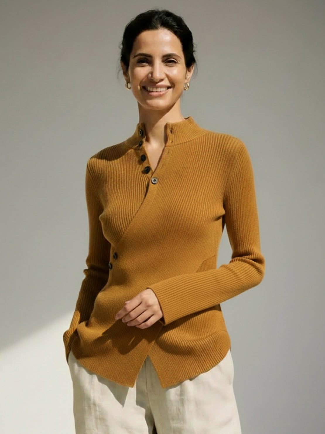 Asymmetric wrap ribbed knit top with diagonal button closure and flared cuffs in slim fit