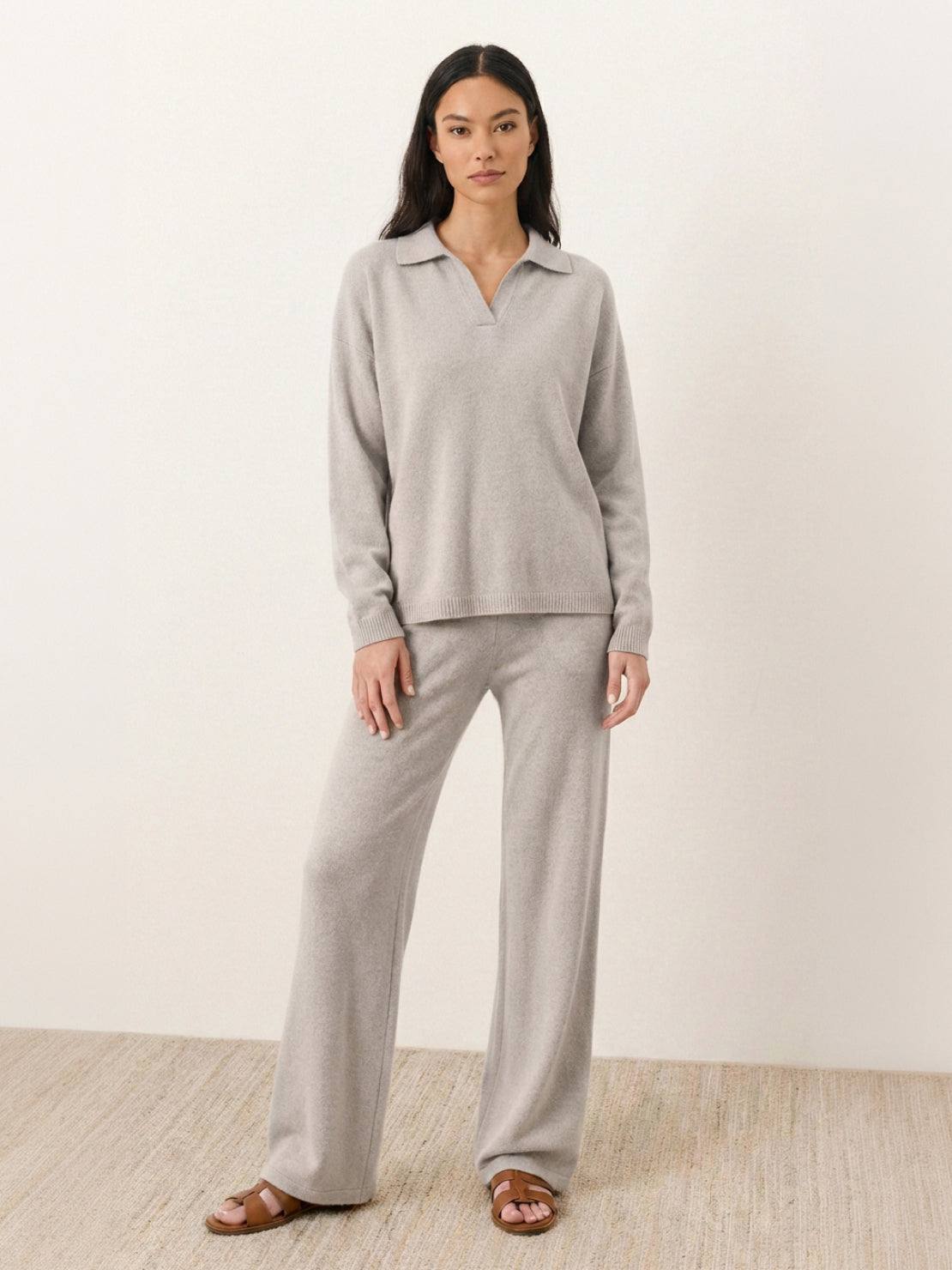 woman wearing oversized polo knit loungewear set with V-neck and straight-leg pants