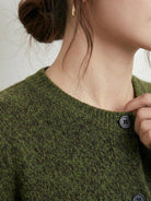 Marled knit merino wool cardigan with contrasting buttons and ribbed cuffs, cozy layered look