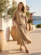 Two-piece 100% cotton cotton wrap skirt and hip-length top set with natural crinkle finish and hidden elastic waistband