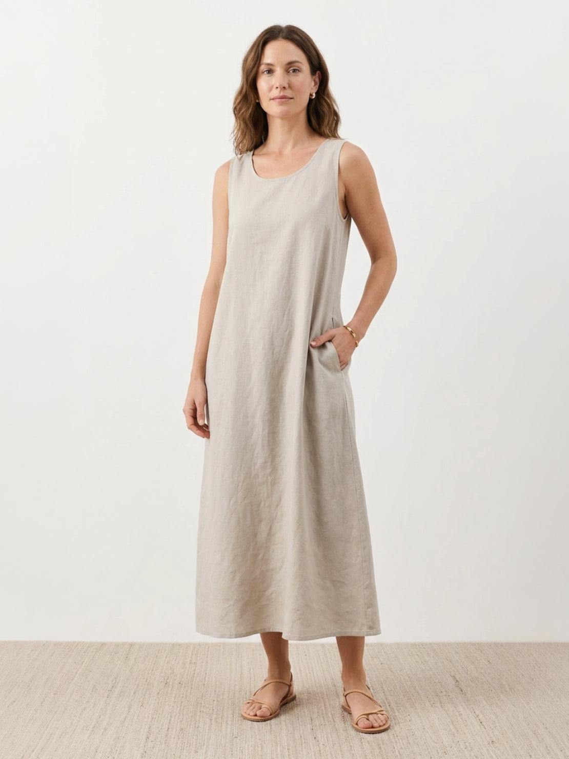 White cotton linen sleeveless maxi dress with round neckline and ankle-length hem