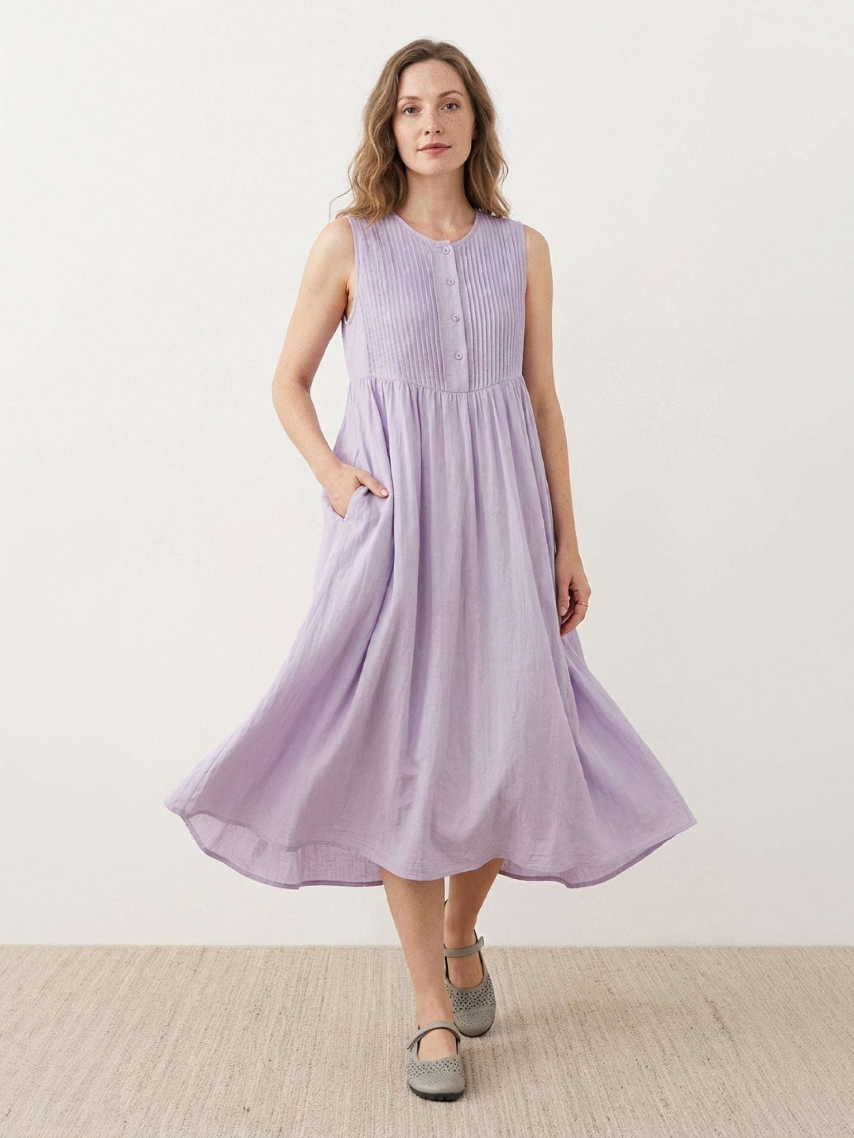 Sleeveless cotton linen pleated midi dress with pintuck chest detail and full A-line skirt in relaxed fit