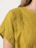 100% linen boxy cap-sleeve top with round neck and hip-length hem