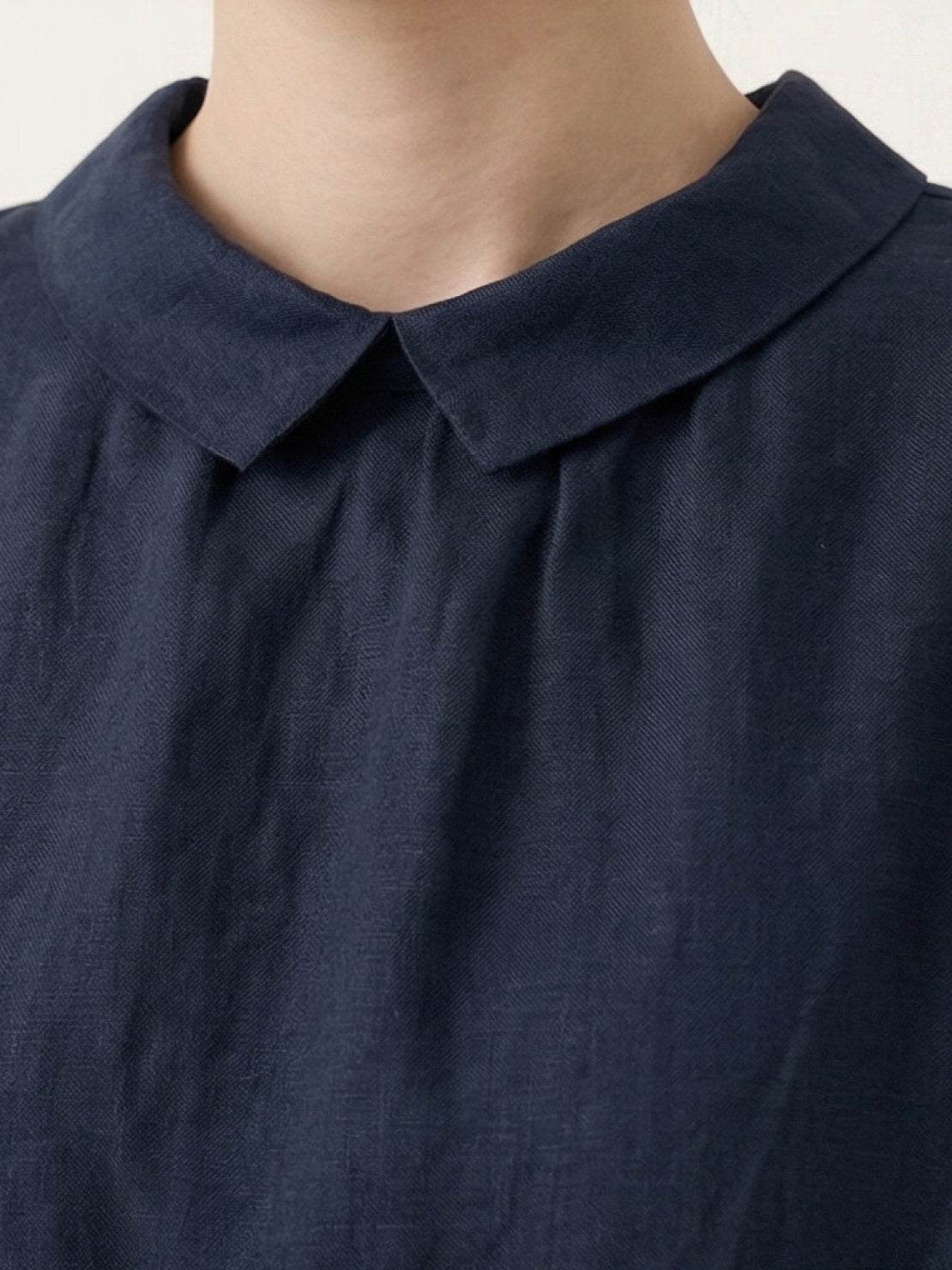 100% linen two-way button blouse with rounded Peter Pan collar and cap sleeves in relaxed A-line silhouette
