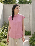 100% linen two-way button blouse with Peter Pan collar and cap sleeves in relaxed A-line silhouette