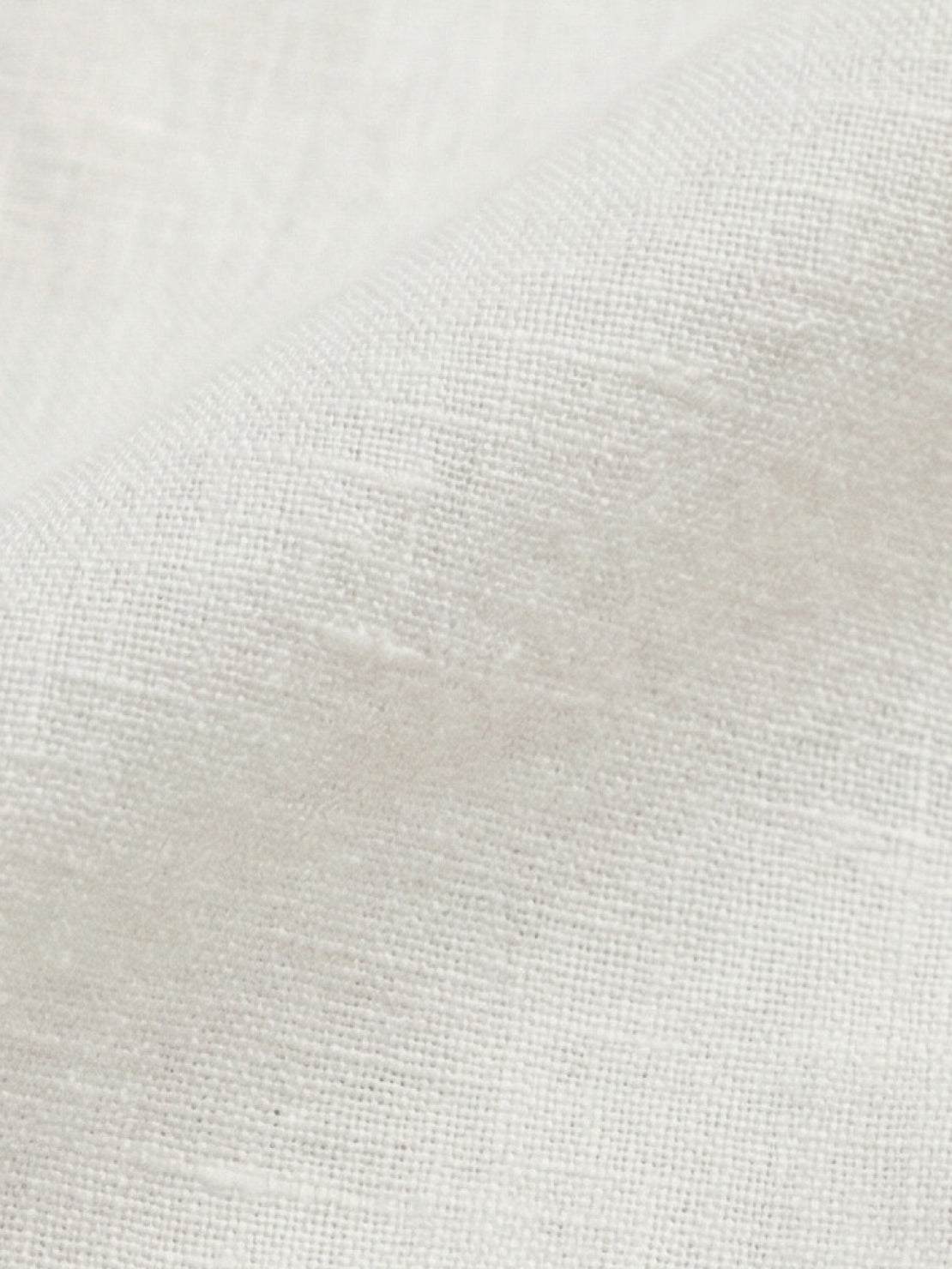 100% linen dropped-shoulder shirt with oversized fit, long rollable sleeves, side slits, and relaxed hip-length cut