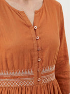 Rusty orange cotton linen dress with smocked waist and folk-art embroidery