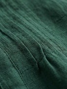 Relaxed cotton linen dress with pintuck pleats, 3/4 sleeves, side slits, and breathable fabric for all-day comfort