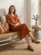 Relaxed cotton linen dress with pintuck pleats, 3/4 sleeves, side slits, and breathable fabric for all-day comfort