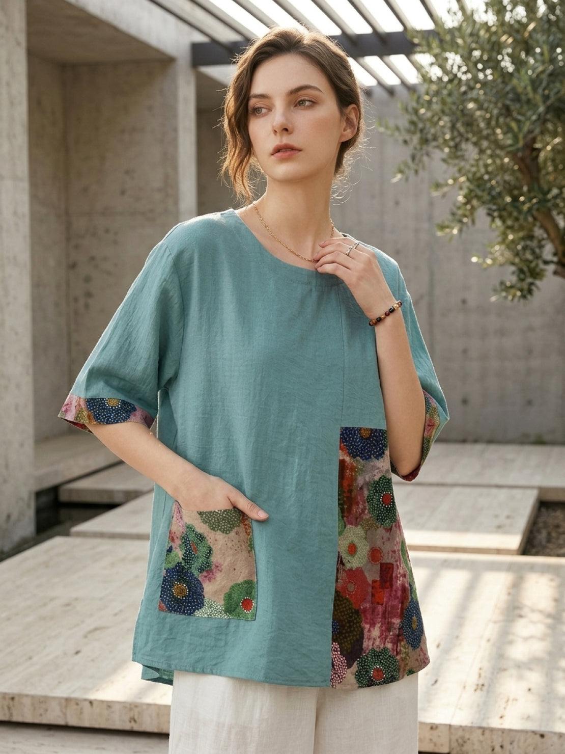 Oversized cotton linen shirt with round neckline, elbow sleeves, and bold floral patchwork panel