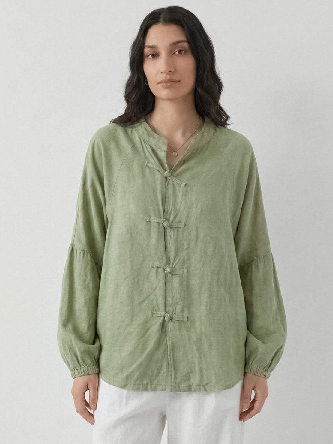 Oversized linen-cotton blouse with batwing sleeves and frog button closures