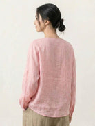 Oversized 100% linen blouse with traditional Chinese frog buttons, collarless neckline, long sleeves, and curved hem