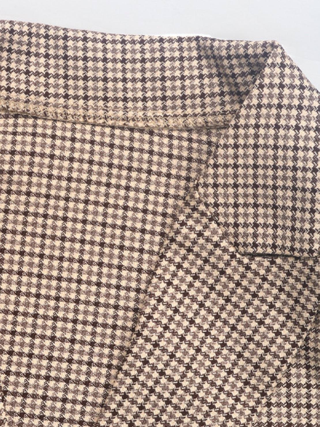 Black and white houndstooth commuter blazer with structured shoulders and relaxed fit