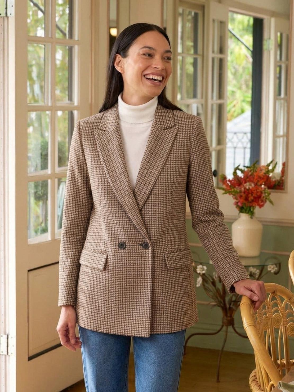 Classic black and white houndstooth commuter blazer with structured shoulders and relaxed fit