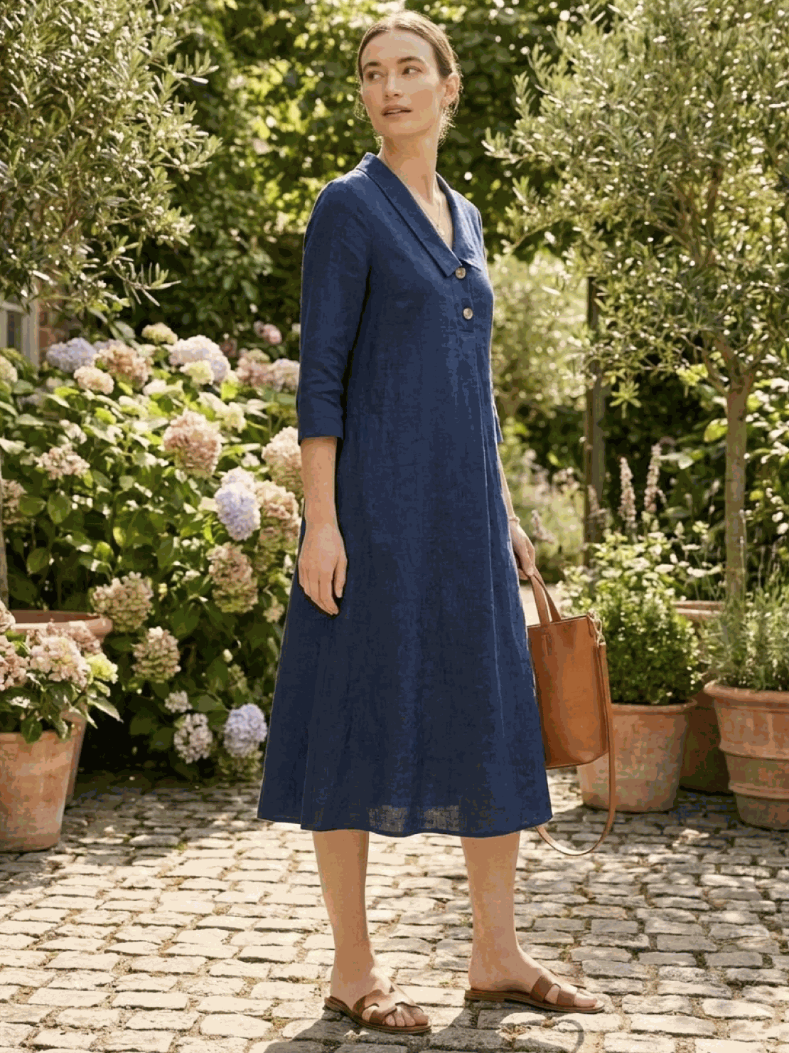 Woman wearing navy linen-look midi dress with relaxed fit and button detail