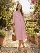 woman wearing navy linen-look midi dress with blazer neckline and buttons, relaxed fit with pockets and 3/4 sleeves