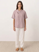 100% linen relaxed V-neck top with asymmetric button detail and short sleeves