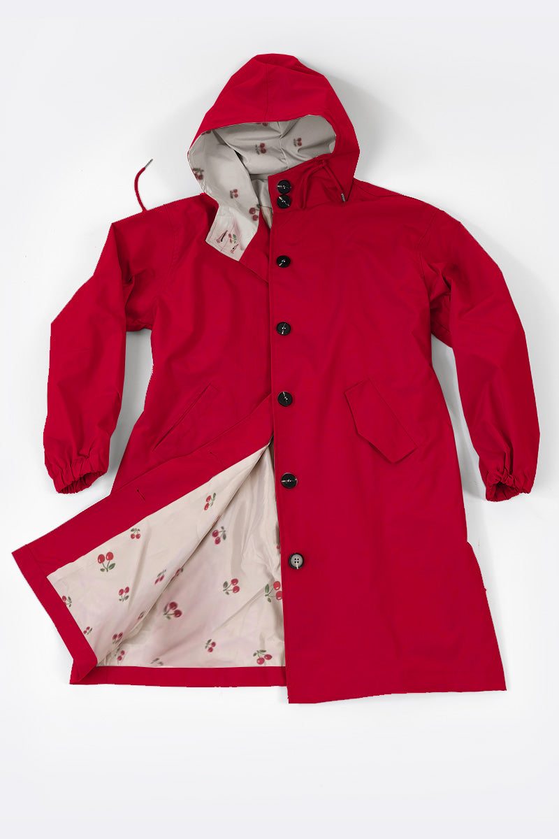 Red water-resistant oversized windbreaker rain jacket with hood and floral interior lining