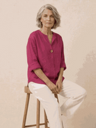 white pure linen age-defying button detail shirt on wooden hanger