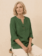 white pure linen age-defying shirt with button detail on hanger