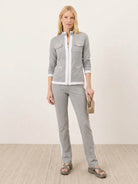 Woman wearing sleek contrast zip two-piece outfit with soft stretch fabric and flattering silhouette