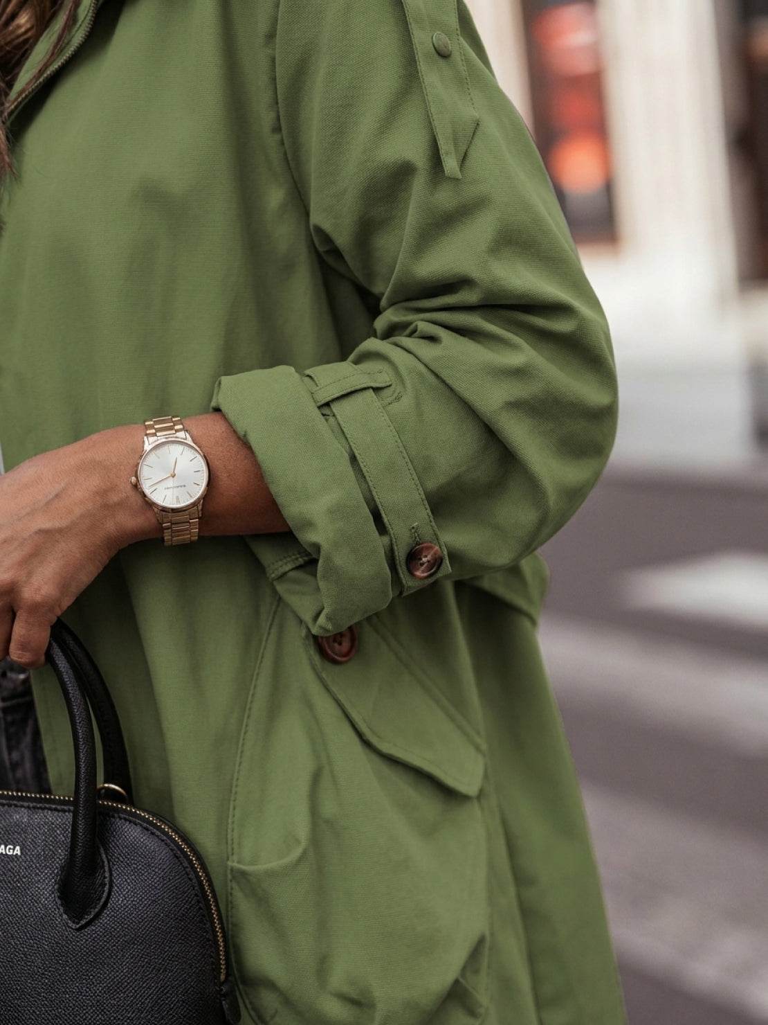 sleek minimalist hooded coat for travel with oversized fit and lightweight warmth