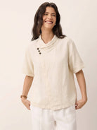 100% linen relaxed V-neck top with asymmetric buttons and short sleeves in breathable fabric