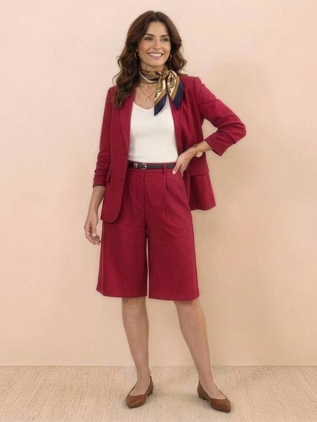 Woman wearing a polished blazer and high-waisted shorts two-piece set in a monochrome style