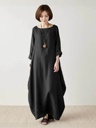Bohemian maxi dress in loose fit linen blend with long sleeves and floor-length hem.