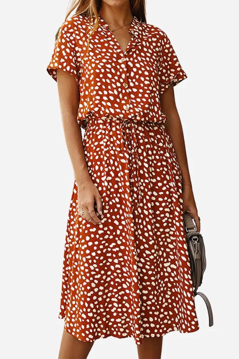 Woman wearing a casual bohemian dress skirt with boho dot print and lace-up waist in rust color