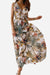 Woman wearing a flowy casual sleeveless dress with a vibrant floral print, ideal for summer outings