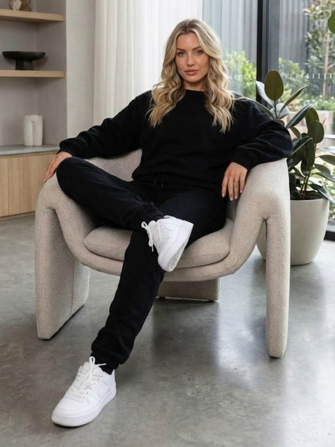 Woman modeling Classic Comfort Athleisure Set in black stretchy fabric for versatile everyday wear