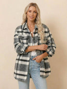 Woman wearing comfy flannel classic button-down shirt in gray and white plaid