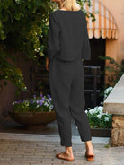 Woman wearing relaxed cotton-linen monochrome longline top and wide-leg pants set