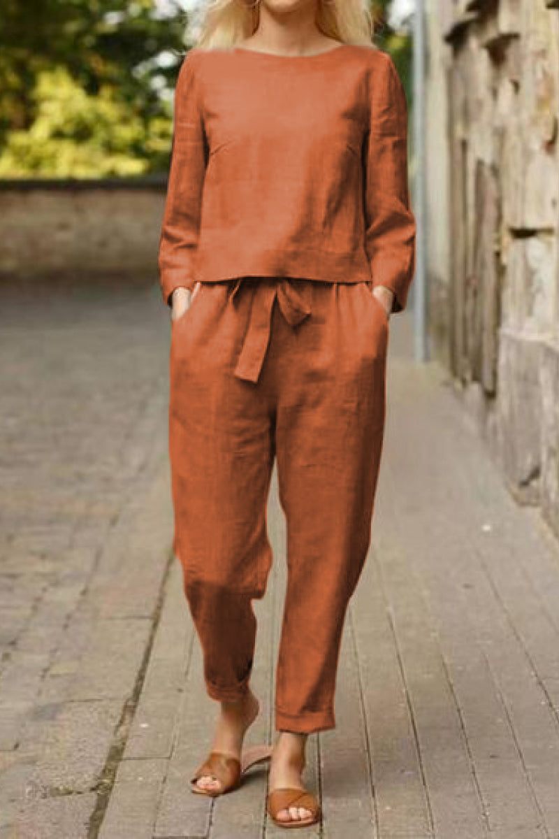 Woman wearing rust-colored cotton-linen monochrome longline top and wide-leg pants set with relaxed fit and tie waist