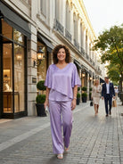 Woman modeling Elegant Layers Two-Piece Set with layered V-neck top and matching pants in soft, wrinkle-resistant fabric