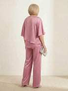 woman wearing Elegant Layers Two-Piece Set with layered V-neck top and matching pants