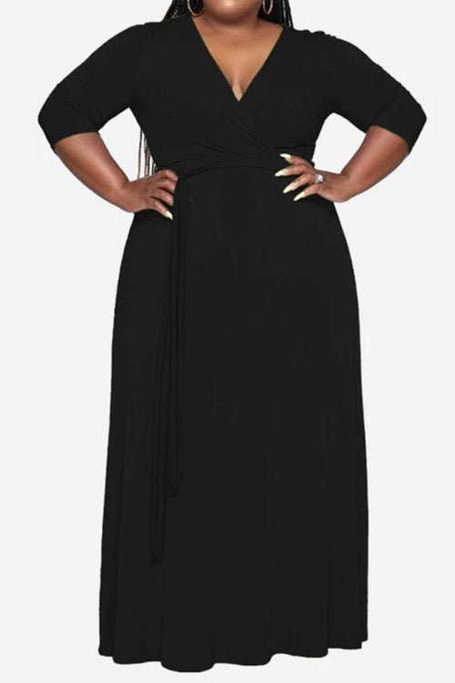 Plus size black belted dress with deep V-neck and 3/4 sleeves for a flattering fit