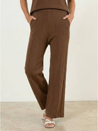 First Class Travel two-piece set in soft wrinkle-resistant viscose-acrylic blend with pleated wide-leg pants and matching top for versatile comfortable elegance